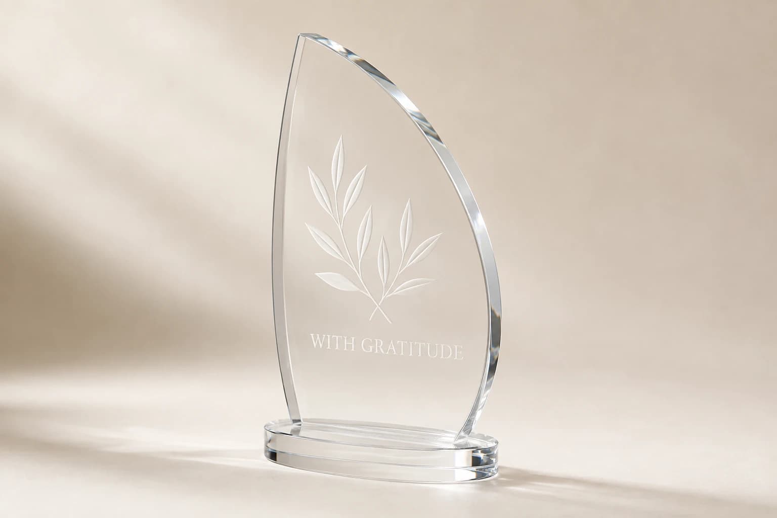 Clear acrylic donor sail with frosted olive leaves and an oval base.